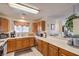 Bright kitchen with ample counter space, modern appliances, and wood cabinets at 1375 E Hacienda Ave # 114, Las Vegas, NV 89119