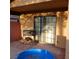 View of home's covered patio with a sliding glass door at 1732 Yellow Rose St, Las Vegas, NV 89108