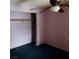 A bedroom with a ceiling fan and open closet at 1732 Yellow Rose St, Las Vegas, NV 89108