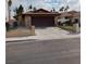 Charming single-story home with a brick facade and a two-car garage at 1732 Yellow Rose St, Las Vegas, NV 89108