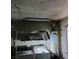 Utility room area with a washer, dryer, water heater, and wire shelving at 1732 Yellow Rose St, Las Vegas, NV 89108