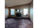 Comfortable living room features a fireplace and natural light from the bright, sunny windows at 1732 Yellow Rose St, Las Vegas, NV 89108