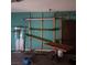Unfinished storage room with hanging shelves at 1732 Yellow Rose St, Las Vegas, NV 89108