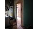 Utility room with water heater, washer, dryer, and exterior door at 1732 Yellow Rose St, Las Vegas, NV 89108