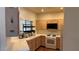 Well-lit kitchen features wooden cabinetry, white appliances, and a convenient dish rack by the sink at 1947 Cutlass Dr # 0, Henderson, NV 89014