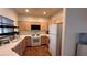 Well-lit kitchen with wooden cabinets, white countertops, and essential appliances at 1947 Cutlass Dr # 0, Henderson, NV 89014