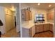 Functional kitchen featuring wooden cabinets, white appliances, and a window over the sink at 1947 Cutlass Dr # 0, Henderson, NV 89014