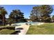 Serene community pool surrounded by mature trees, providing a peaceful and enjoyable swimming experience at 1947 Cutlass Dr # 0, Henderson, NV 89014