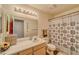 Bathroom with vanity, large mirror and shower featuring patterned curtain at 2008 Mesquite Ln # 305, Laughlin, NV 89029