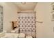 Cozy bathroom featuring a shower-tub combo with patterned curtain and neutral wall color at 2008 Mesquite Ln # 305, Laughlin, NV 89029