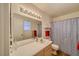 Bathroom features a large mirror, vanity, and a shower with a patterned curtain at 2008 Mesquite Ln # 305, Laughlin, NV 89029