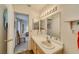 Bathroom features a sink with a large mirror and view into the bedroom at 2008 Mesquite Ln # 305, Laughlin, NV 89029