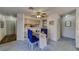 Dining area with blue chairs and a glass table open to the kitchen and entry at 2008 Mesquite Ln # 305, Laughlin, NV 89029