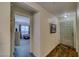 Hallway with wood floors leading to a bedroom with carpet at 2008 Mesquite Ln # 305, Laughlin, NV 89029