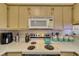 Kitchen with a white stovetop and matching white microwave at 2008 Mesquite Ln # 305, Laughlin, NV 89029