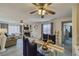 Open-concept living and dining area with a fireplace and ample natural light at 2008 Mesquite Ln # 305, Laughlin, NV 89029