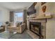 Close-up of the living room showing a fireplace and a comfortable sofa set at 2008 Mesquite Ln # 305, Laughlin, NV 89029