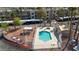 Aerial view of a community pool, hot tub, picnic area, and barbecue, all enclosed by fencing at 2008 Mesquite Ln # 305, Laughlin, NV 89029