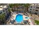 Aerial view showcasing a pool and spa with covered seating areas, surrounded by tropical landscaping at 2008 Mesquite Ln # 305, Laughlin, NV 89029