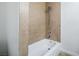 Tiled shower and tub combination with a shower wand and white walls at 204 Orland St # 2, Las Vegas, NV 89107