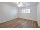 Neutral bedroom features wood flooring, updated ceiling fan, and shuttered window at 204 Orland St # 2, Las Vegas, NV 89107
