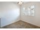Neutral bedroom features tiled floors, white walls, updated lighting, and shuttered window at 204 Orland St # 2, Las Vegas, NV 89107