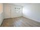 Bright bedroom features wood floors, white walls and trim, shuttered windows, and closet at 204 Orland St # 2, Las Vegas, NV 89107