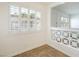 Bright dining room features tiled floors, shuttered windows with outdoor views, and updated lighting at 204 Orland St # 2, Las Vegas, NV 89107