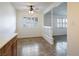 Open dining area features tiled floors, shuttered windows, updated lighting and access to adjacent rooms at 204 Orland St # 2, Las Vegas, NV 89107