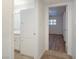 Hallway area transitions to full bath and bedroom with updated lighting and tiled floors at 204 Orland St # 2, Las Vegas, NV 89107
