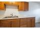 Close-up view of the kitchen cabinets, sink, and laminate countertops at 204 Orland St # 2, Las Vegas, NV 89107