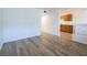 Spacious living room with wood-look flooring and view to the kitchen at 204 Orland St # 2, Las Vegas, NV 89107