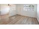 Bright living room features wood floors, white walls and trim, shuttered windows, and open access to additional rooms at 204 Orland St # 2, Las Vegas, NV 89107