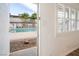 View through a doorway showing the community pool and palm trees from inside the apartment at 204 Orland St # 2, Las Vegas, NV 89107