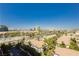 An aerial view showcasing lush landscaping and cityscape with iconic buildings in the distance at 211 E Flamingo Rd # 714, Las Vegas, NV 89169