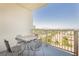 Balcony with a metal table and four chairs, offering a scenic view of the city at 211 E Flamingo Rd # 714, Las Vegas, NV 89169
