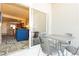 A cozy balcony furnished with a metal table and chairs, extending from a comfortable living area at 211 E Flamingo Rd # 714, Las Vegas, NV 89169