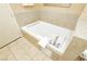 A luxurious bathroom featuring a spotless white bathtub and elegant silver fixtures at 211 E Flamingo Rd # 714, Las Vegas, NV 89169