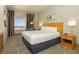 Bright bedroom with a comfortable bed, stylish curtains, and a scenic city view at 211 E Flamingo Rd # 714, Las Vegas, NV 89169