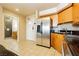 The kitchen features stainless appliances, wooden cabinets, and a stylish breakfast bar at 211 E Flamingo Rd # 714, Las Vegas, NV 89169