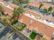 Aerial view of townhome community features manicured landscaping, red tile roofs, and private patios at 2292 Cassatt Dr, Henderson, NV 89074