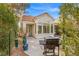 Backyard patio area showcasing a built-in grill and lush landscaping, ideal for outdoor dining at 2292 Cassatt Dr, Henderson, NV 89074