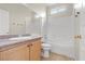 Bathroom with single sink vanity with granite counters and tub-shower combo at 2292 Cassatt Dr, Henderson, NV 89074