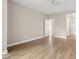 A bright, spacious bedroom with hardwood floors and a ceiling fan at 2292 Cassatt Dr, Henderson, NV 89074