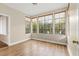 Bright bedroom with wood floors, large windows offering outside views, and neutral walls at 2292 Cassatt Dr, Henderson, NV 89074