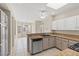 Bright kitchen with granite countertops, appliances, and a breakfast bar, perfect for cooking and entertaining at 2292 Cassatt Dr, Henderson, NV 89074