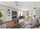 Bright living room featuring a fireplace, built in shelving, ceiling fan and ample natural light at 2292 Cassatt Dr, Henderson, NV 89074