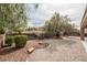 Xeriscaped backyard with iron fencing at 2388 Aztec Ruin Way, Henderson, NV 89044