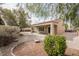 A backyard featuring gravel landscaping and a covered patio, perfect for outdoor entertaining at 2388 Aztec Ruin Way, Henderson, NV 89044