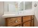 Bathroom sink and vanity featuring wood cabinets at 2388 Aztec Ruin Way, Henderson, NV 89044